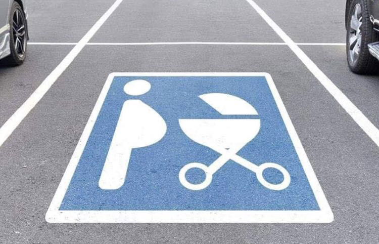A photo of a parking spot reserved for pregnant people.