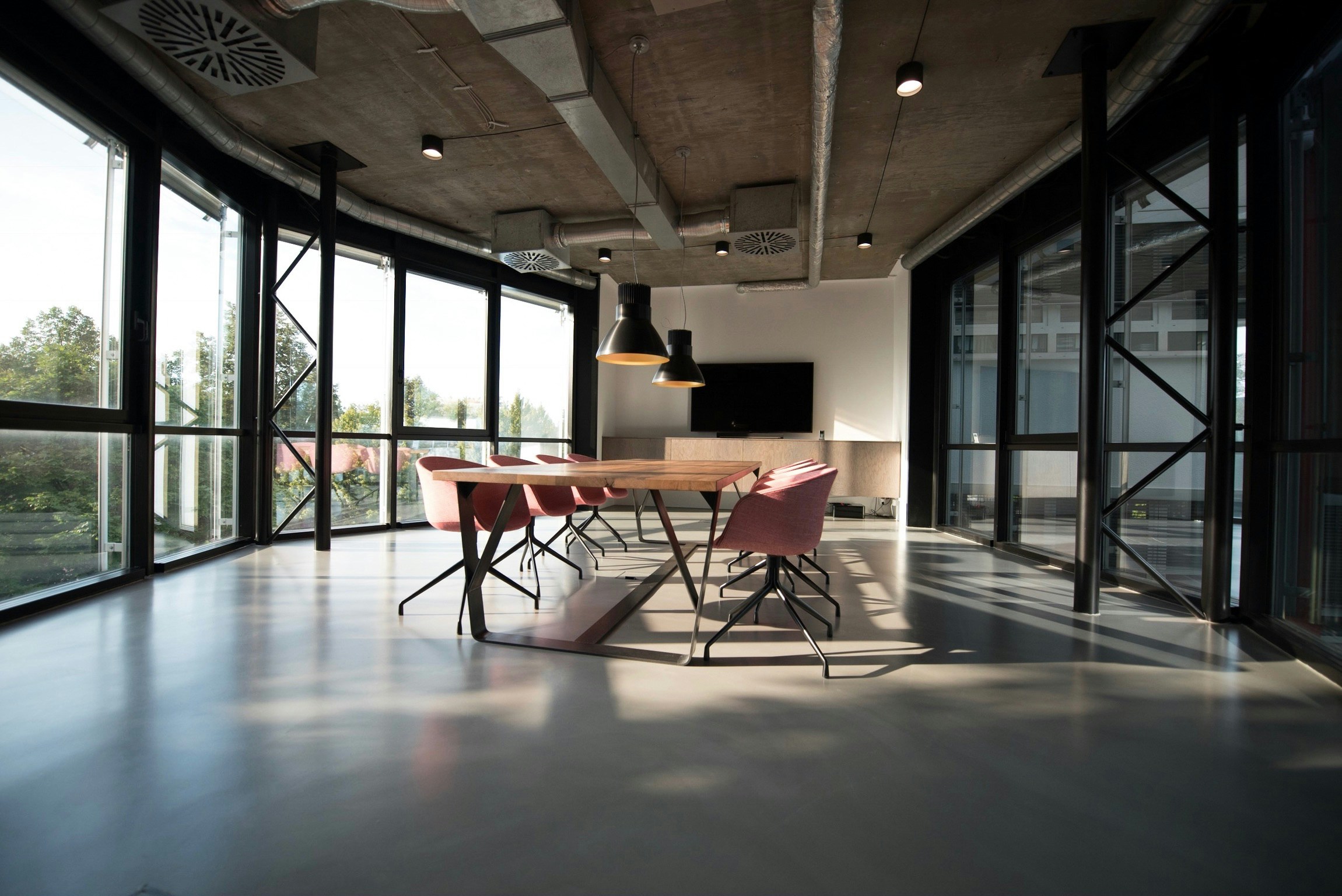 An empty conference room with an empty meeting table.