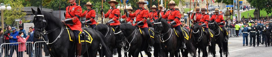 Ottawa, Canada. September 19, 2022. The Royal Canadian Mounted Police lead a memorial parade on Wellington Street heading towards Christ Cathedral for a commemorative ceremony for Queen Elizabeth.